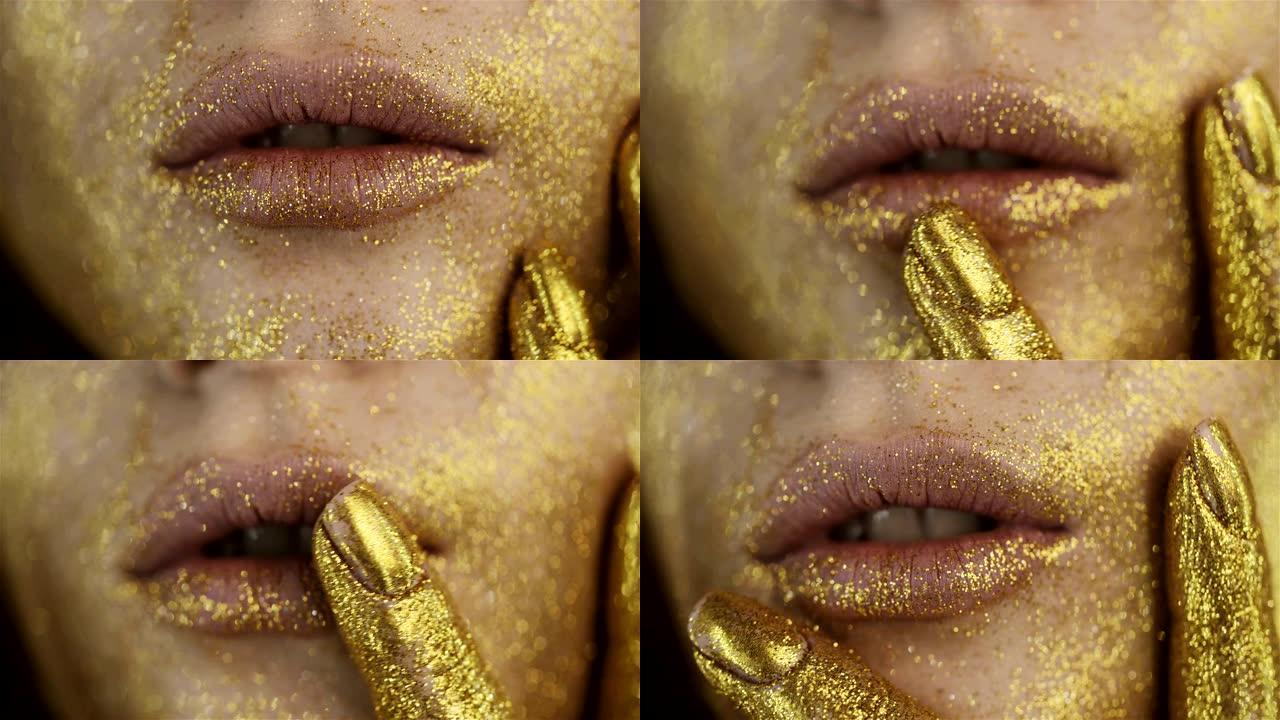 金色化妆的女孩脸。金漆。人体艺术。