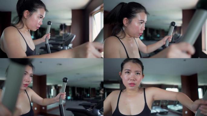 年轻美丽多汗的亚洲韩国女子在酒店或健身俱乐部训练的健身房锻炼照片在运动和健康的生活方式理念中努力工作