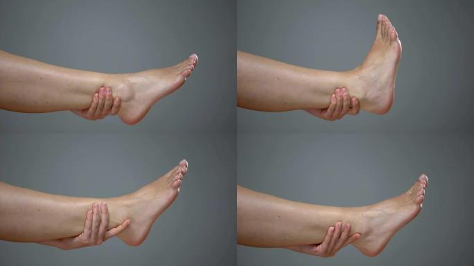 女性按摩厌倦了高跟鞋腿，跟腱扭伤，静脉曲张和抽筋