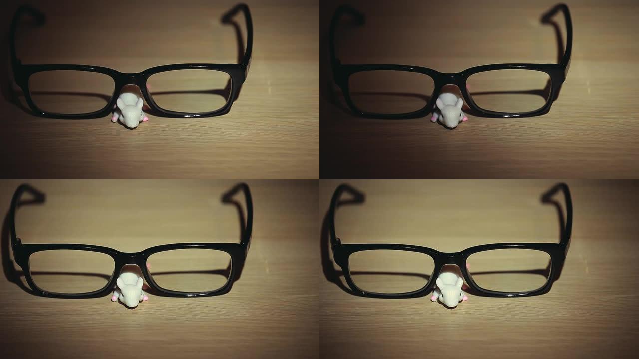 鼠标眼镜木桌背景