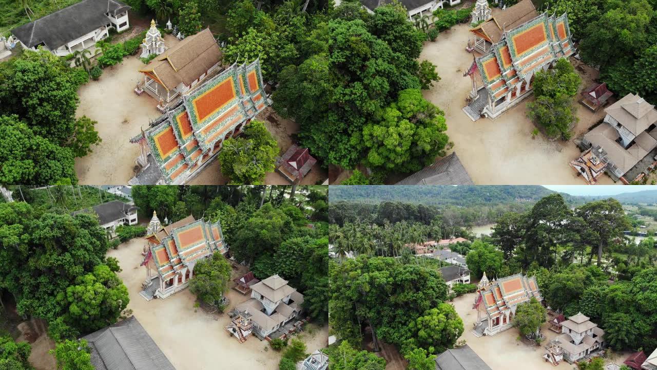 森林之间的经典佛教寺庙。从无人机上方可以看到泰国山丘附近绿树之间的经典佛教寺院。苏梅岛。旅游、冥想和