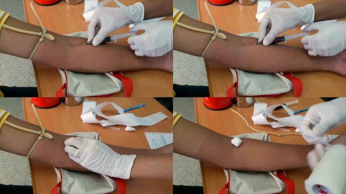护士用针抽血进行体检。