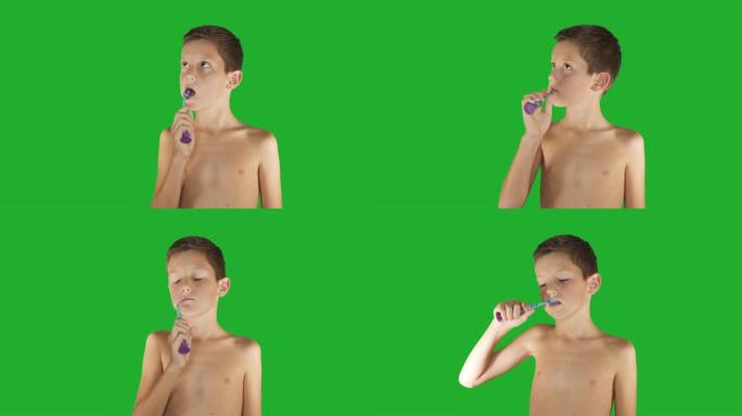 美丽的男孩在绿色屏幕上刷牙