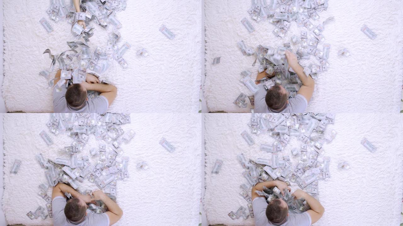 男女在床上互相扔很多美元的钞票，慢动作，俯视图