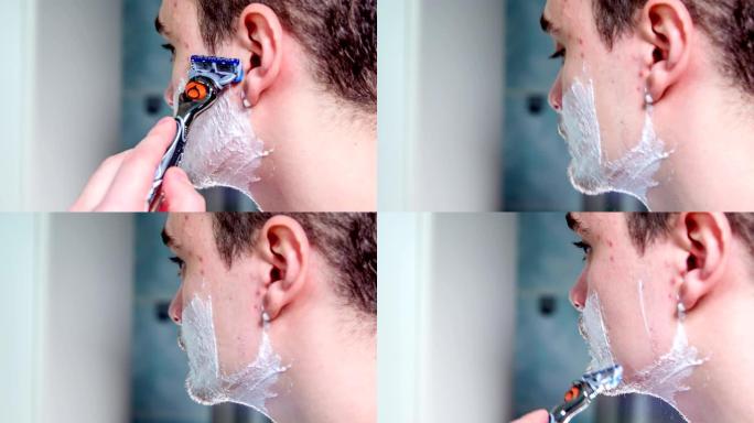 男人的脸上满是泡沫，他开始刮胡子