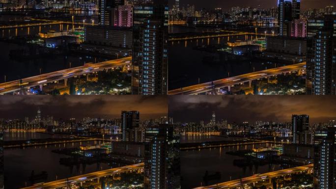 延时俯视图香港城市景观之夜，海港附近城市的天际线