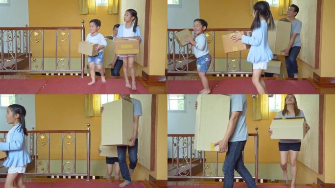 亚洲家庭生活方式拿着箱子进家，纸箱和布置房子