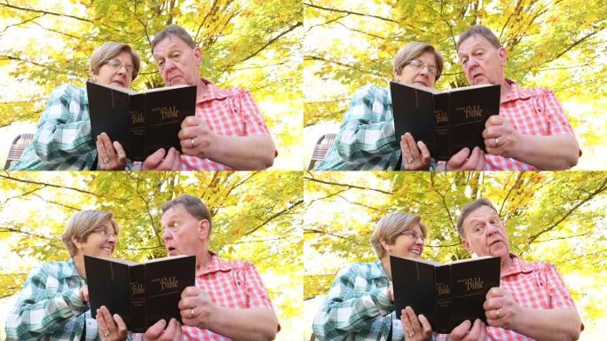 一起读圣经的成熟夫妇