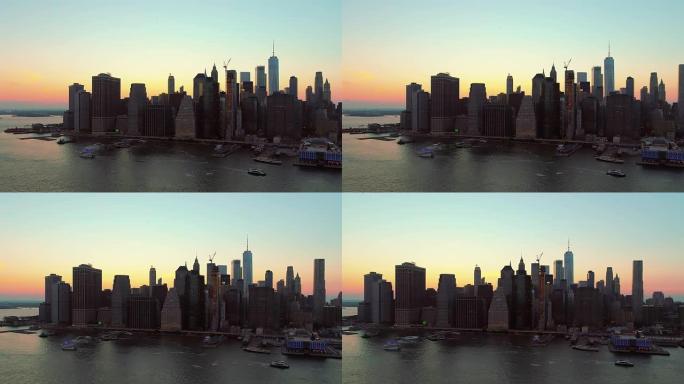日落时从东河上的布鲁克林高地到曼哈顿市中心的空中风景。缓慢的左向全景运动。