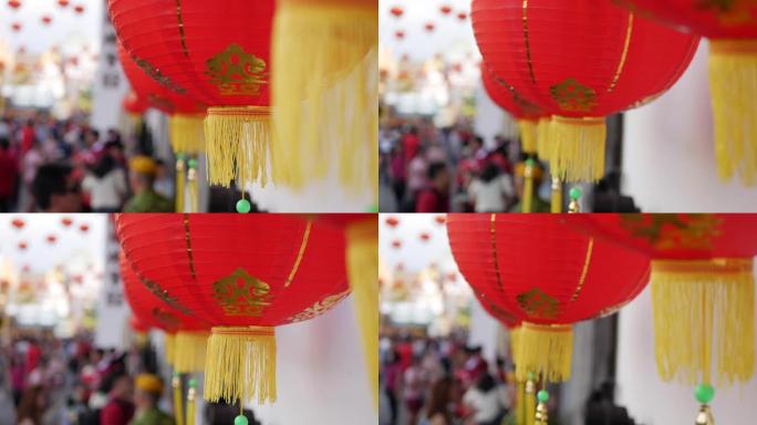 人群背景下农历新年期间红灯笼的特写镜头。中国春节或农历新年文化。4k