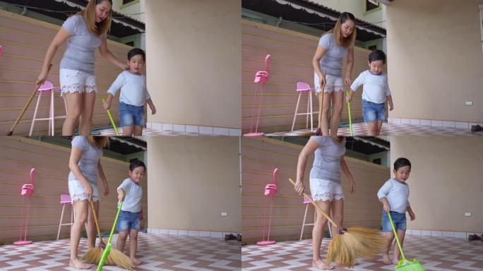 母亲和儿子正在打扫房子