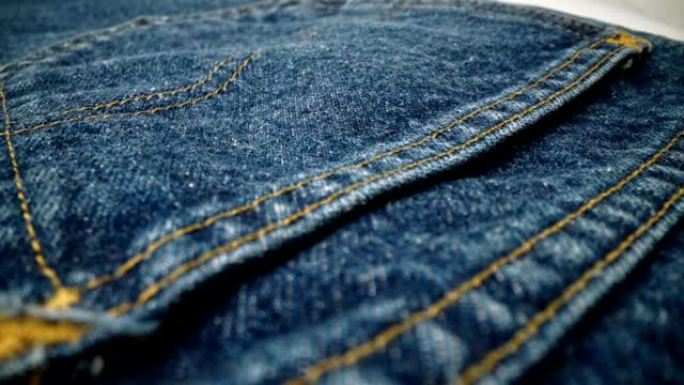 极端详细的蓝色牛仔牛仔裤纹理在多莉拍摄在布料表面。