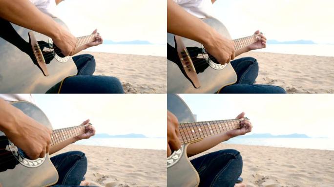 4K。日落时分，一个男人在海滩上弹奏原声吉他，感觉放松
