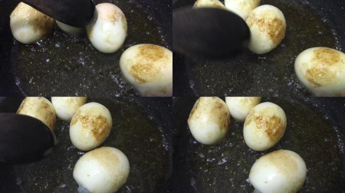 在平底锅中煎鸡蛋的镜头