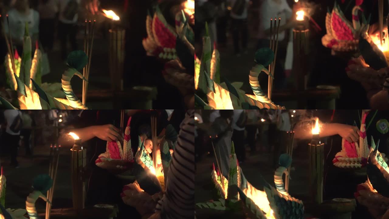 泰国满月民俗节中漂浮的loy kathong和蜡烛