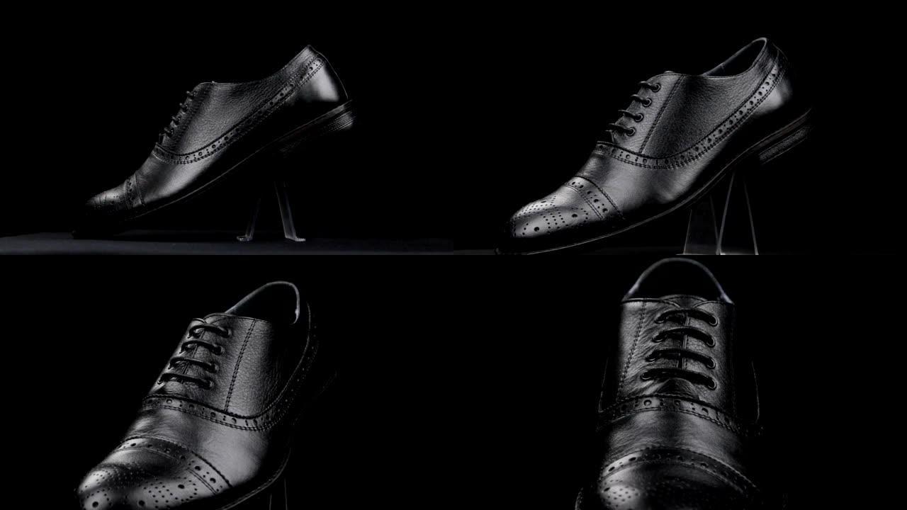 黑色背景上黑色经典男鞋的旋转和近似。复制空间。