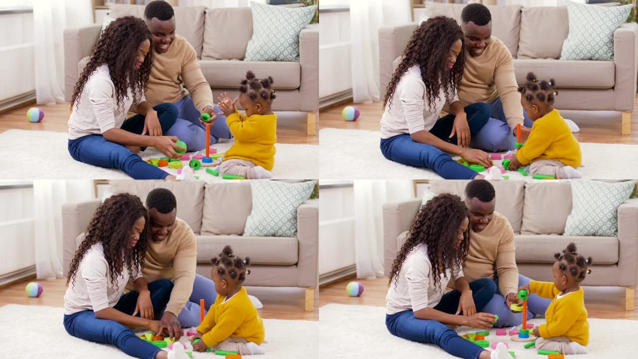 一个非洲家庭在家里和小女儿玩耍