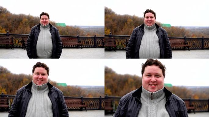 从特写放大，快乐胖子的肖像直接看着相机