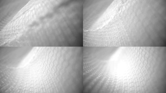 闪亮的网布流动纹理多莉在特写视图宏拍摄。