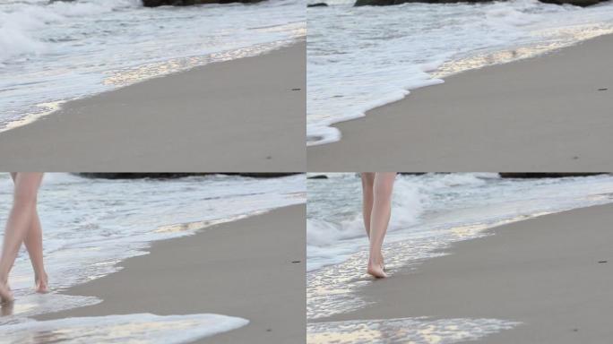 海上冲浪，沙滩前面。在海滩上行走的脚女孩