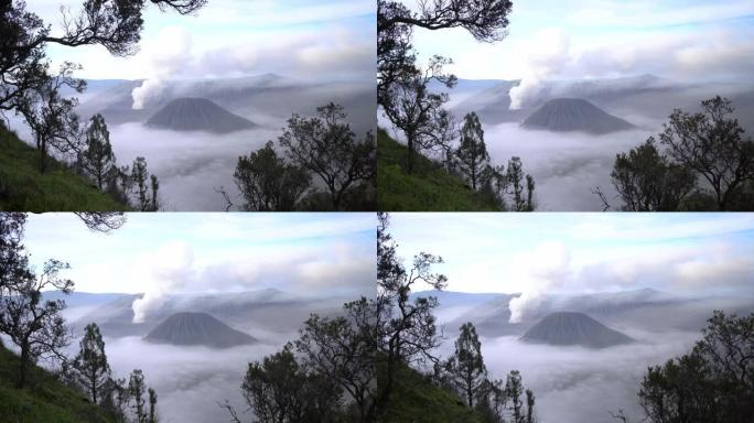 雾中日出时布罗莫火山的风景