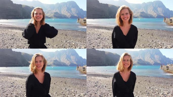 大加那利岛海滩边微笑着金发的模特