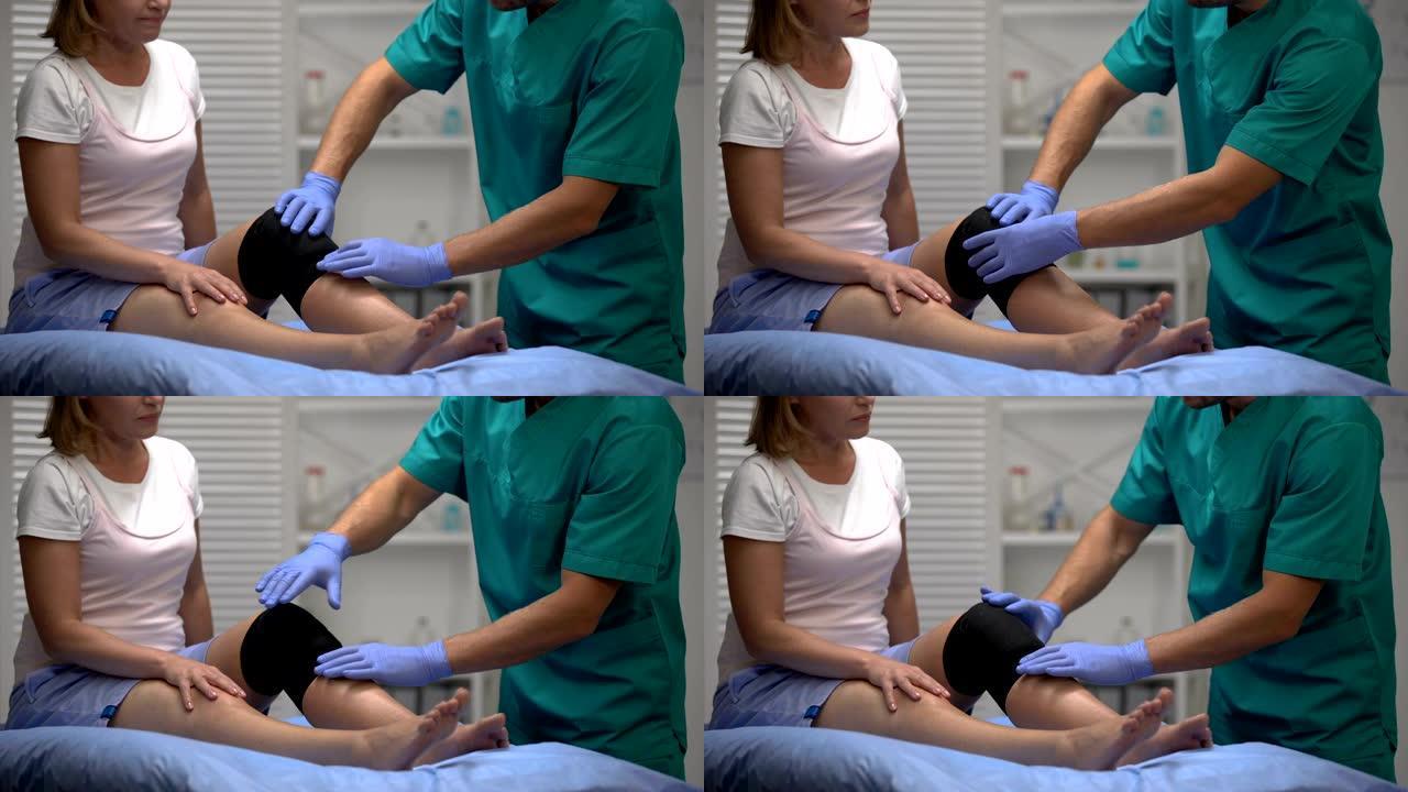 外科医生检查女性患者腿部膝关节支架的位置，康复