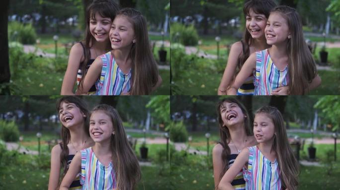 孩子们拥抱并大笑。小朋友们的肖像