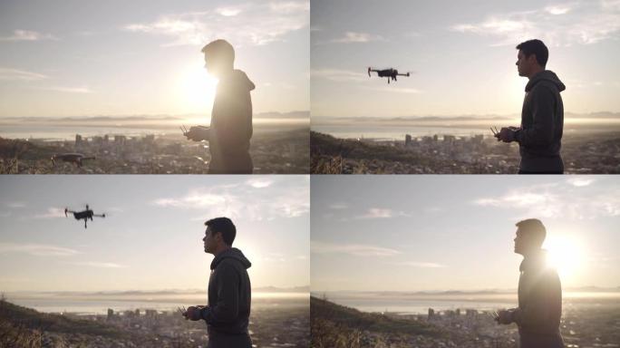 一名男子在阳光明媚的日子里脱下无人机并使其飞越云层和城市上空的电影镜头-未来技术