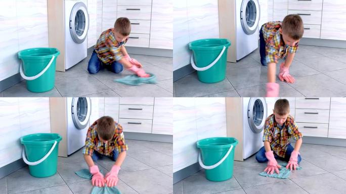 戴着橡胶手套的男孩在厨房洗地板。孩子的家庭职责。