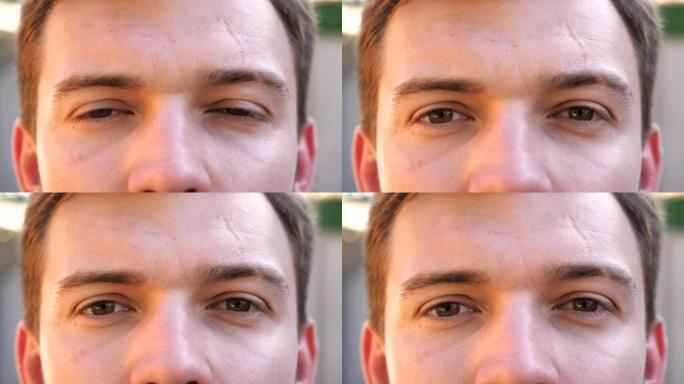 用自信的户外景象关闭男人凝视和眨眼的棕色眼睛。在模糊的背景上看着镜头的男性脸的肖像。严肃男人的面部表