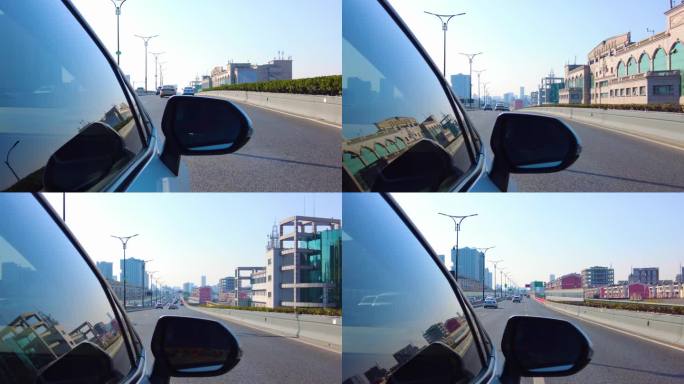 城市汽车开车第一视角后视镜风景视频素材