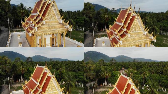森林之间的经典佛教寺庙。从无人机上方可以看到泰国山丘附近绿树之间的佛教修道院。苏梅岛。旅游、冥想和东