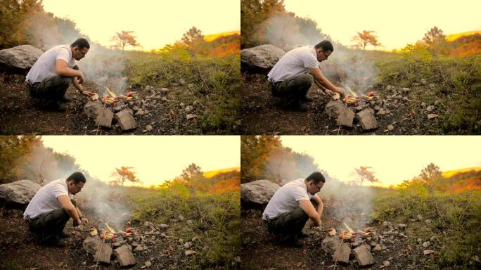 森林里的香肠烧烤。男人在大自然中烤香肠