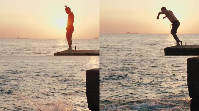 年轻人从海上码头跳下来，在美丽的日出时做前空翻，慢动作