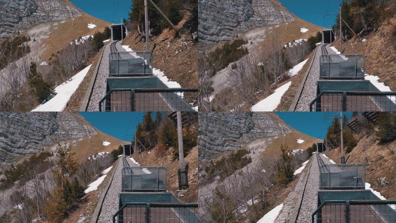 齿轮火车在铁路上的雪山中行驶。瑞士，阿尔卑斯山