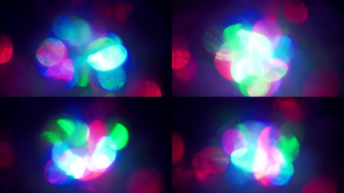 色彩缤纷的圣诞波景，闪烁五彩霓虹灯。抽象模糊的背景，平滑而急剧闪烁的新年粉色蓝色和绿色红色灯光。闪烁