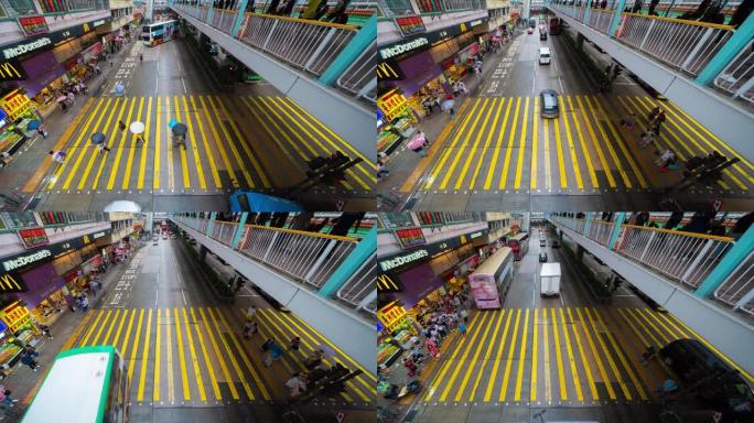 雨时在斑马线或人行横道上行走的人群的俯视图的时间流逝。繁忙城市的交通道路。香港市区。