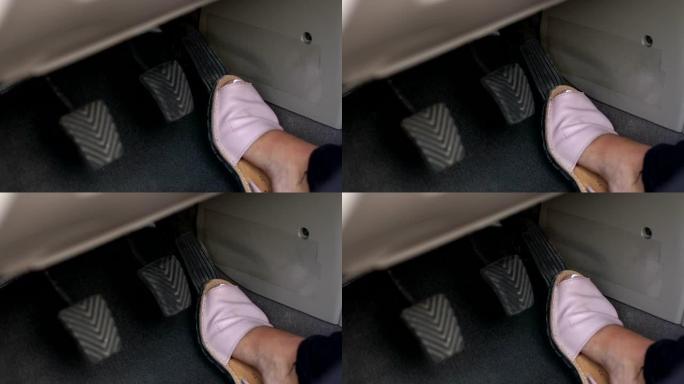 一个女人在车里踩油门的特写镜头，慢动作。