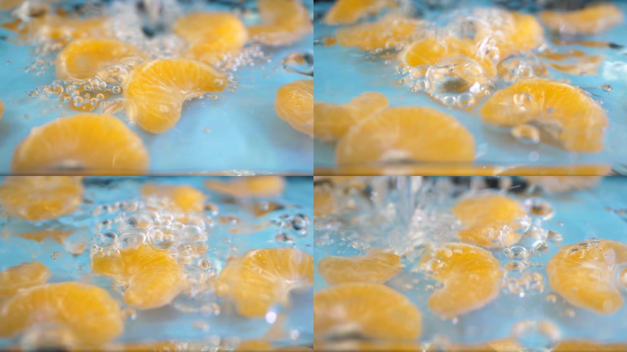 水落并溅到橘子切片上
