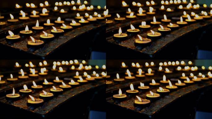 教堂中有许多浅的燃烧蜡烛