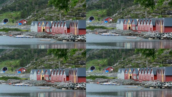 挪威戈多亚阿尔内斯。夏日的红色和黄色彩色木制码头。奥勒森镇附近的戈多伊岛