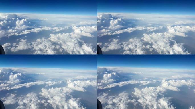 夏季飞机窗户上巨大的参差不齐的云层