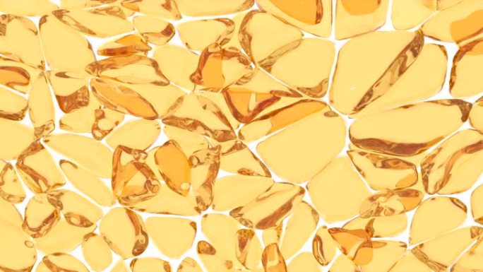 脂肪细胞被拉伸和压缩。白色背景上金色摩洛哥坚果油精华素的抽象特写，用于装饰设计。摩洛哥坚果油。抽象黄