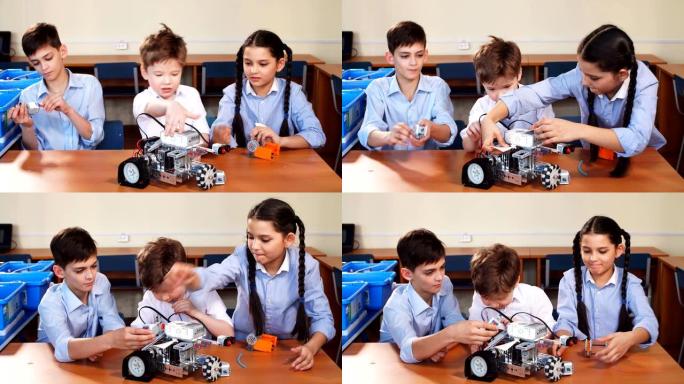孩子们在参观机器人技术展览时玩电动机器人