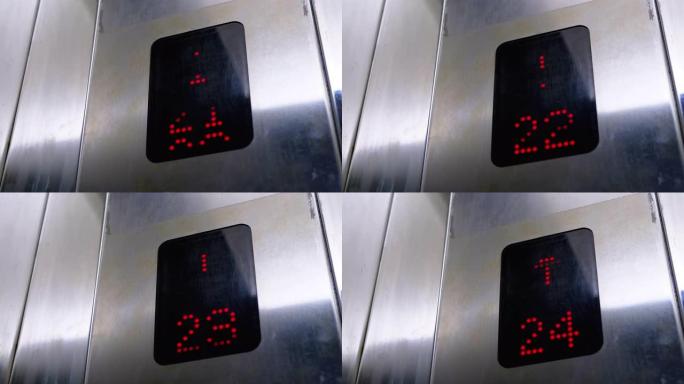 带有箭头向上的电梯中的数字显示显示从21到24的楼层