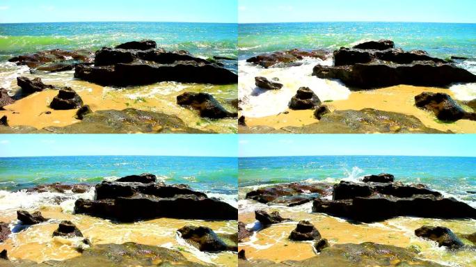 海滩上岩石和海浪的美丽景色