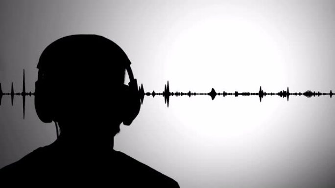 男士黑色剪影对着灰色墙壁戴着耳机听音乐，背景中的实时波形