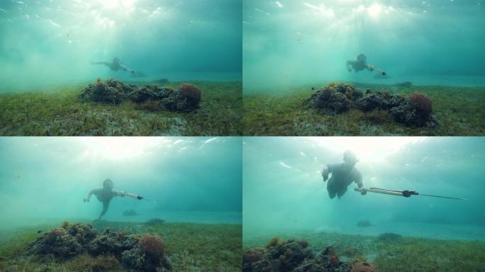 水下长矛鱼用枪探索海洋寻找鱼。