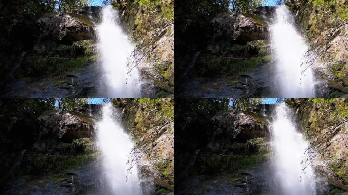 秋天的makhunseti瀑布。落水撞击岩石。慢动作